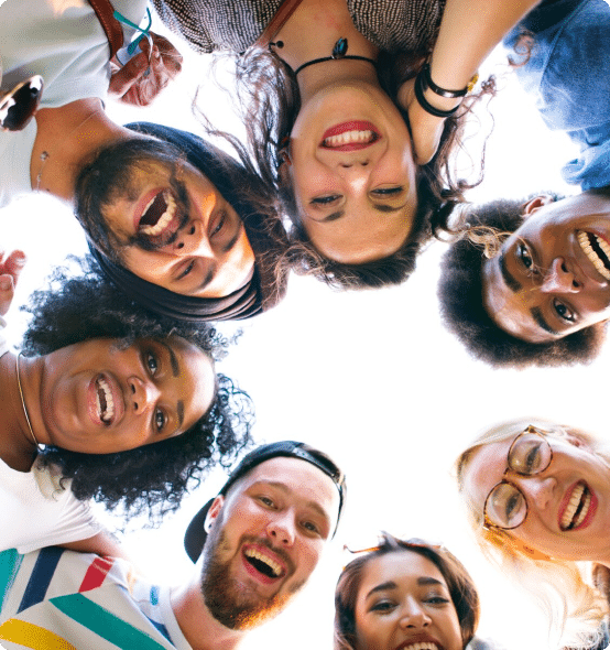 Group of people in a circle smiling